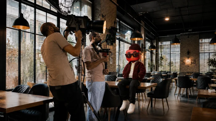 Filming on location in a cafe